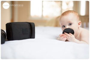 baby eating lens cap