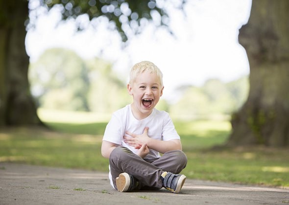 little boy laughing 