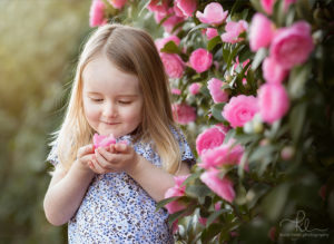 little girl with pink flowers